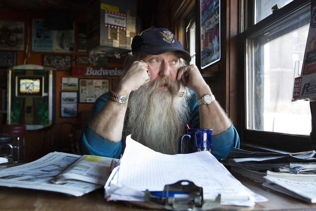 Second place, Larry Fullerton Photojournalism Scholarship - Alex Driehaus / Ohio UniversityChris Wolf of Athens, affectionately referred to as "Wolfy" by bar regulars, talks on the phone at the bar he owns, The Smiling Skull Saloon, in Athens. Wolf bought the bar after working in a coal mine for a number of years, and got the idea for the name from a friend with whom he often rode his Harley Davidson motorcycle.