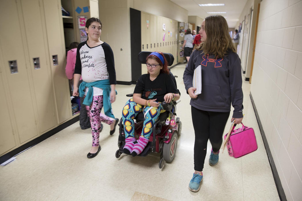 Second place, Larry Fullerton Photojournalism Scholarship - Alex Driehaus / Ohio UniversityAdyn travels through the hall with Macy and their friend Katie Sheridan during the school day. Katie introduces herself as "Adyn's second best friend."