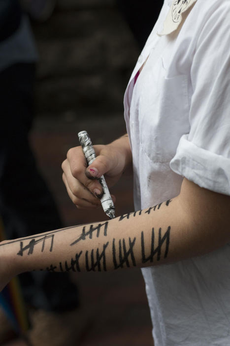 Second place, Larry Fullerton Photojournalism Scholarship - Alex Driehaus / Ohio UniversityOhio University senior Hannah Ticoras marks tallies on her arm every two minutes to represent how often people in North America are sexually assaulted during a rally on Ohio University's campus in Athens. The rally, organized by the student group Fuck Rape Culture, was one of many held throughout the semester.