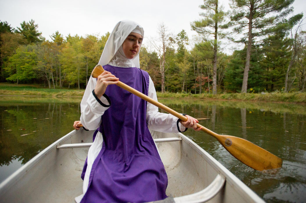 First place, Larry Fullerton Photojournalism Scholarship - Sarah Stier / Ohio UniversitySister Leah paddles a canoe around St. Francis Pond during Recreation Hour at the Children of Mary Convent in Newark. Each day, the sisters have two separate hours of the day for recreation, where they can be found playing board games, relaxing by the pond, or reading.  