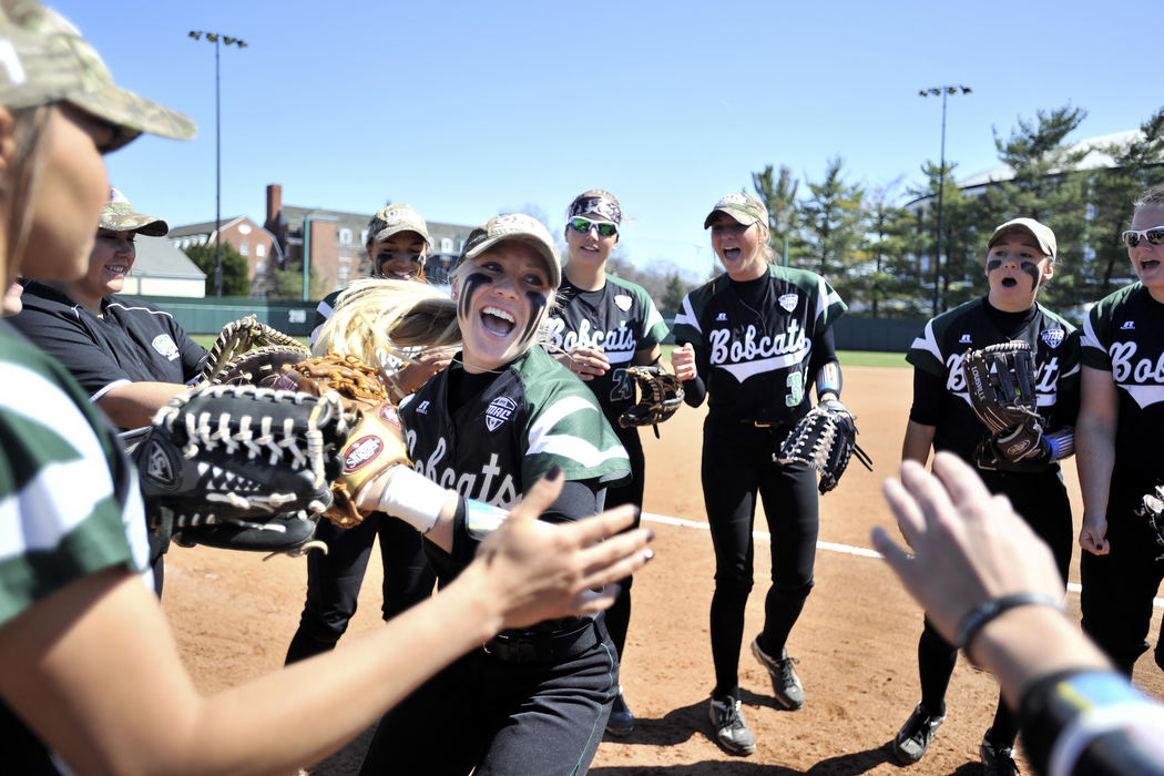 First place, Larry Fullerton Photojournalism Scholarship - Sarah Stier / Ohio UniversityOhio Bobcats sophomore Taylor Saxton receives high-fives from her teammates as she is introduced before the team's game against Western Michigan.