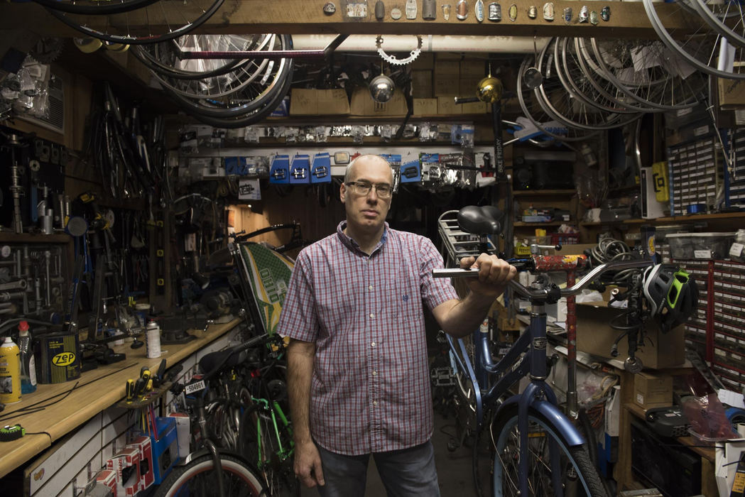 First Place, Larry Fullerton Photojournalism Scholarship - Alexandria Skowronski / Ohio UniversityJohn Lefelhocz, of Macedonia, Ohio poses for a portrait in his shop CyclePath in Athens.  Lefelhocz has been the co-owner of CyclePath since 1985.