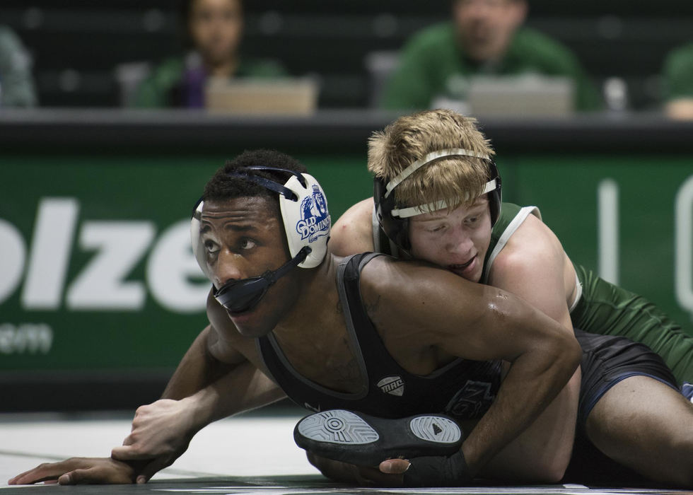 First Place, Larry Fullerton Photojournalism Scholarship - Alexandria Skowronski / Ohio UniversityOhio University's Kade Kowalski, weight class 149 of Nashport, Ohio, faces Old Dominion's Kenan Carter, of Aurora, Ill., during a match in the Convocation Center in Athens. 