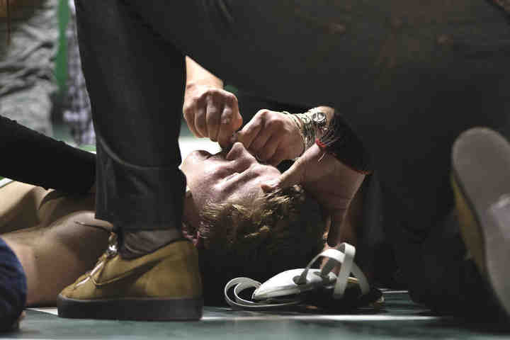 Third place, , Larry Fullerton Photojournalism Scholarsahip - Alexandria Skowronski / Ohio UniversityOhio University's Austin Reese of Urbana passes out after the second period of a match and stops breathing for approximately three minutes. Reese was conscious when he was taken to the hospital.  (Alexandria Skowronski/Ohio University)