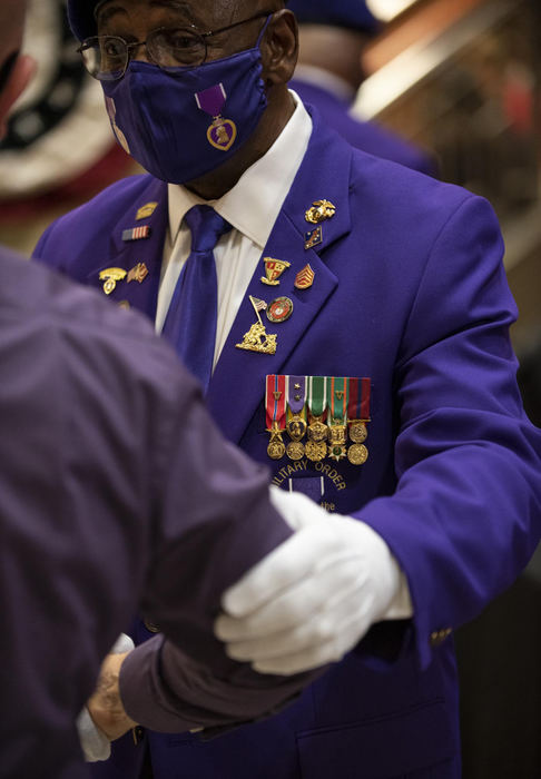 First Place - Larry Fullerton Photojournalism Scholarship , Tanner Pearson / Ohio UniversityJerry Ferris shakes hands with a fellow patron at an event held to recognize Mason, OH as becoming a purple heart city on Nov. 9, 2020. This event was done to honor veterans, purple heart veterans, and the veterans that are no longer with us.