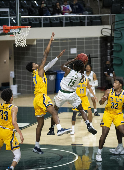 First Place - Larry Fullerton Photojournalism Scholarship , Tanner Pearson / Ohio UniversityOhio University guard Lunden McDay (15) steps back to shoot the ball at a home game against Kent State on Jan. 16, 2021. Ohio University lost 89-79.