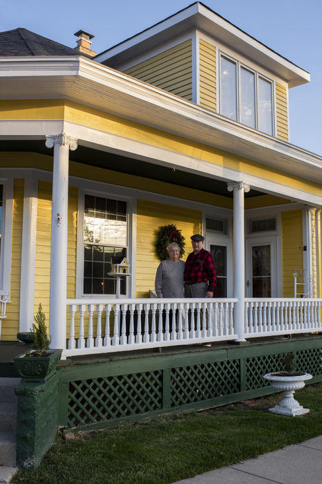 First Place - Larry Fullerton Photojournalism Scholarship , Tanner Pearson / Ohio UniversityCheryl and James Wesley stand for a portrait outside of their house on Nov. 16, 2020. The house was built on 1902 and was originally a doctor’s office. The house has been changed over the years from medical to dental practices to residential. The couple moved into the house in 1985. “We love Mason, the changes are all for the best. Houses, industrial, all of it is for the better of the city.”