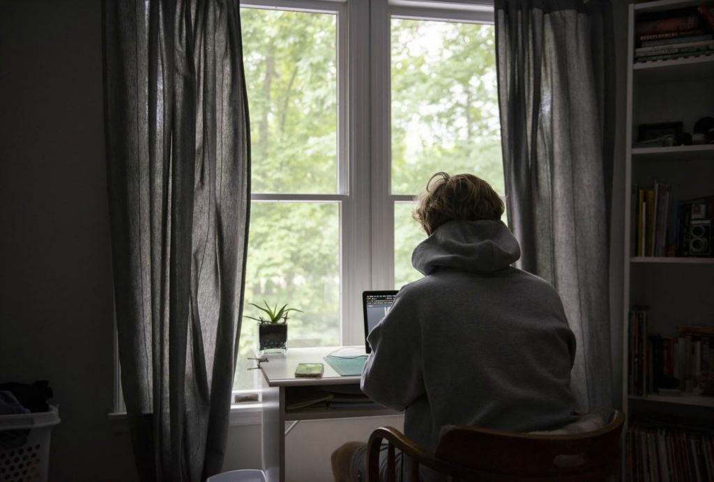 First Place - Larry Fullerton Photojournalism Scholarship , Tanner Pearson / Ohio UniversityAfter breakfast, Tanner begins on his schoolwork for the day on August 27th, 2020. Morning fades into the afternoon as class work and Zoom calls are completed one after another. The view outside the window causes distractions every once in a while, but never disappoints.