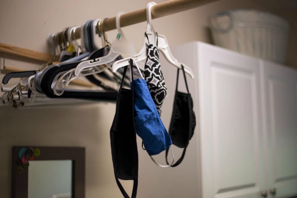 First Place - Larry Fullerton Photojournalism Scholarship , Tanner Pearson / Ohio UniversityMasks are hung to dry from a hanger in the family laundry room on August 24, 2020. The new normal shows itself in many ways around the house. 