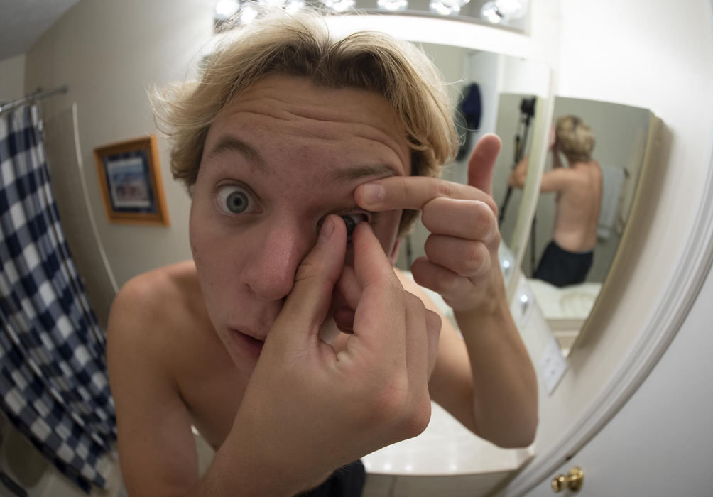 First Place - Larry Fullerton Photojournalism Scholarship , Tanner Pearson / Ohio UniversityTanner removes his contacts after a long day on August 26th, 2020. He has been wearing contacts for the past four years and prefers them over glasses.