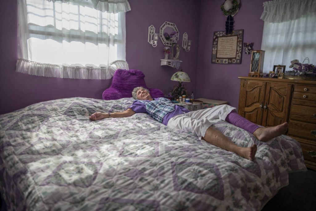 Second Place - Larry Fullerton Photojournalism Scholarship , Grace Wilson / Ohio UniversityCheryl Brockman, 71, of Bellbrook, Ohio, lays in her "purple bedroom," on the morning of Sept. 8, 2020. Cheryl loves the color purple and collects all things purple. "My husband tells me if I bring home one more thing that's purple, I'm going to have to take it right back."