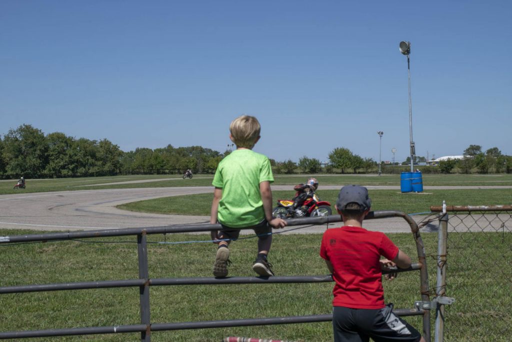 Second Place - Larry Fullerton Photojournalism Scholarship , Grace Wilson / Ohio UniversityReid Scruggs (right) and Ben Scruggs (left) watch their father, Michaels Scruggs (center) compete in the Ohio Endurance Race in Circleville, on Sept. 5, 2020.