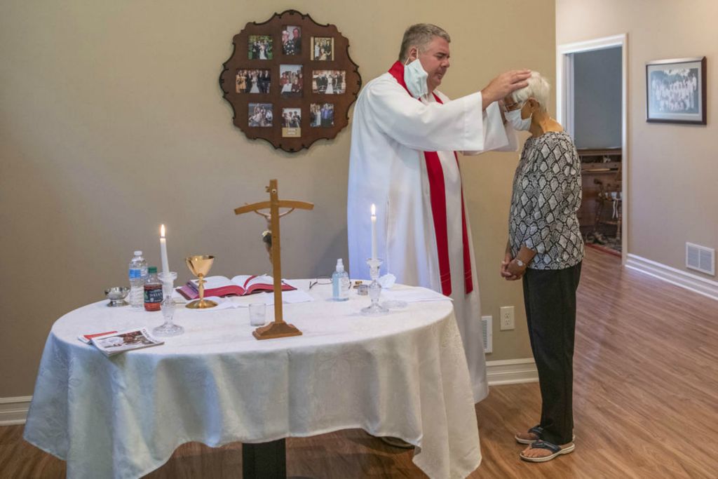 Second Place - Larry Fullerton Photojournalism Scholarship , Grace Wilson / Ohio UniversityFather Tony Sejba administrates the Anointing of the Sick to Manda Hoffmann in her home after she was diagnosed with liver cancer, during the afternoon of June 22, 2020. 