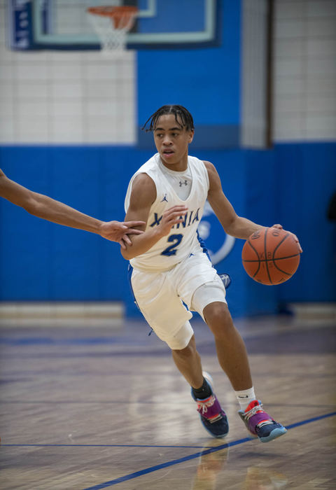 Second Place - Larry Fullerton Photojournalism Scholarship , Grace Wilson / Ohio UniversityXenia's Josiah Harding, 2, dribbles down the court at the game against Troy on Dec. 9, 2020. Xenia goes on to win 62-56.