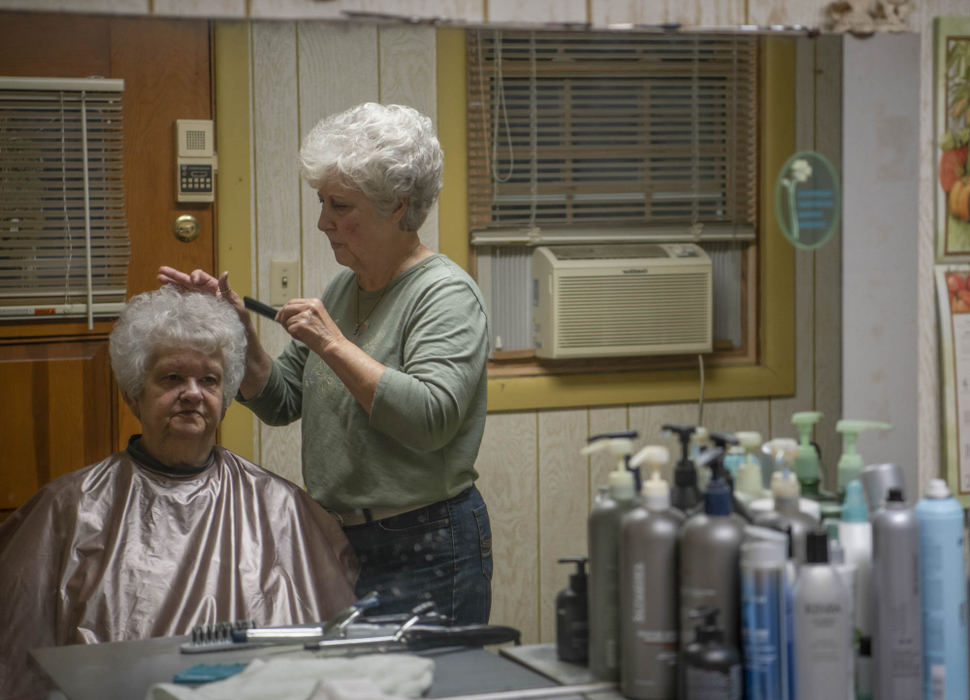 Second Place - Larry Fullerton Photojournalism Scholarship , Grace Wilson / Ohio UniversitySue Matthews (left) gets her hair done by Karen (right) early in the morning of Oct. 16, 2020. Karen opened her in-home beauty shop in Sept. of 1973, and still operates. Her customers are regarded as friends, and she enjoys listening their joys and concerns while she styles their hair.