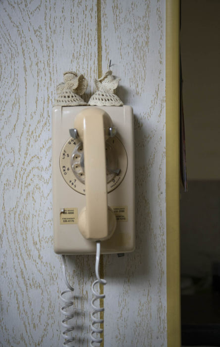 Second Place - Larry Fullerton Photojournalism Scholarship , Grace Wilson / Ohio UniversityAn old phone hangs on the wall of Karen's beauty shop. The two angels on top were made by Sandy McKinney, a long-time customer and friend.