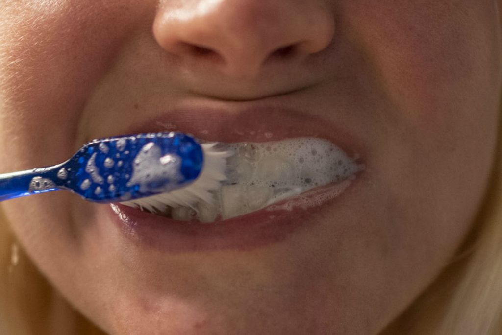 Second Place - Larry Fullerton Photojournalism Scholarship , Grace Wilson / Ohio UniversityI brush my teeth after eating breakfast on Aug. 28, 2020. My dad is a dentist, so I have learned to be very particular about brushing my teeth a multitude of times per day. 