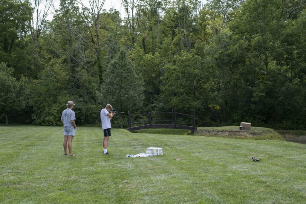 Second Place - Larry Fullerton Photojournalism Scholarship , Grace Wilson / Ohio UniversityTanner and my brother, Luke Wilson, practice shooting targets in the backyard on Sept. 6, 2020. Our Grandpa brought one of his rifles down for them to practice with.