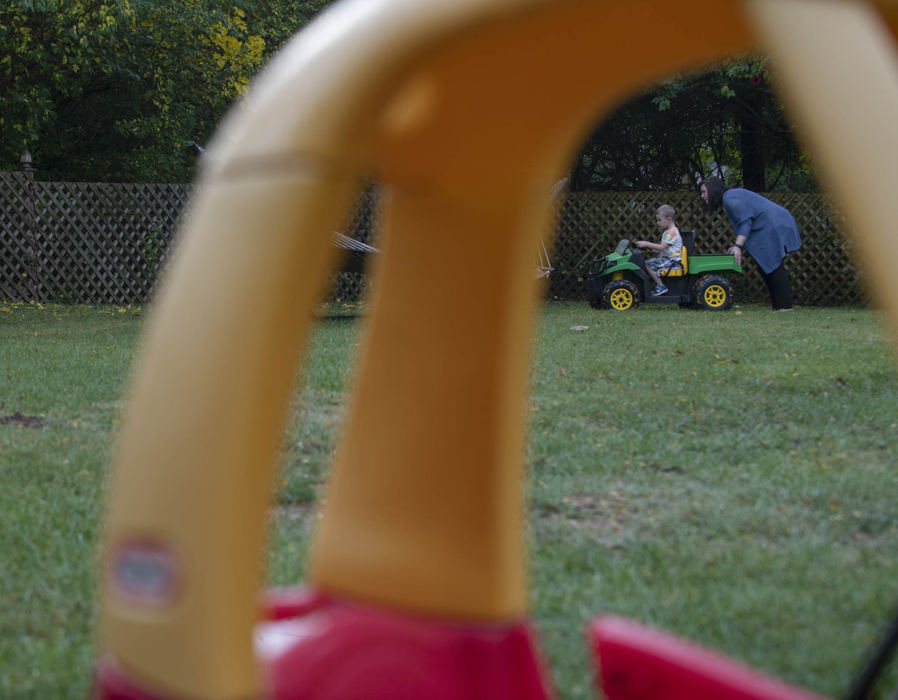 Second Place - Larry Fullerton Photojournalism Scholarship , Grace Wilson / Ohio UniversityKait Sykes pushes her son Bearett around on his toy Gator on the morning of Oct. 22, 2020. Barrett wakes up around 5:30 AM, so the majority of the day's action happens before 10 AM.