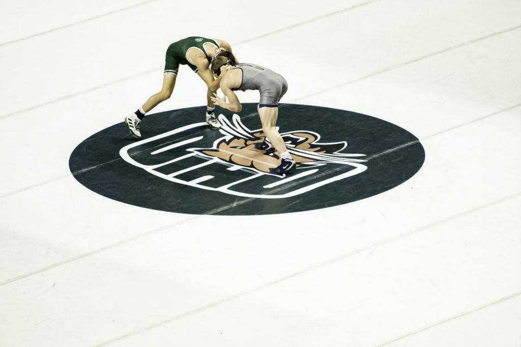 Second Place - Larry Fullerton Photojournalism Scholarship -  A member of the Ohio University wrestling team ties up with a wrestler from the the West Virginia University on Dec. 6, 2021. (Ryan Grzybowski - Ohio University)  