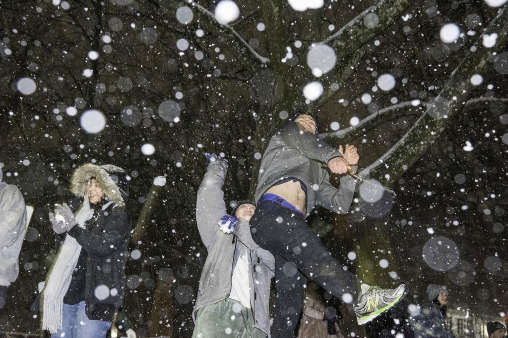 Second Place - Larry Fullerton Photojournalism Scholarship -  Students start a snowball fight as they throw snowballs across Union St. for the first major snowfall for the Spring Semester at Ohio University on Jan. 16, 2022. (Ryan Grzybowski - Ohio University)  