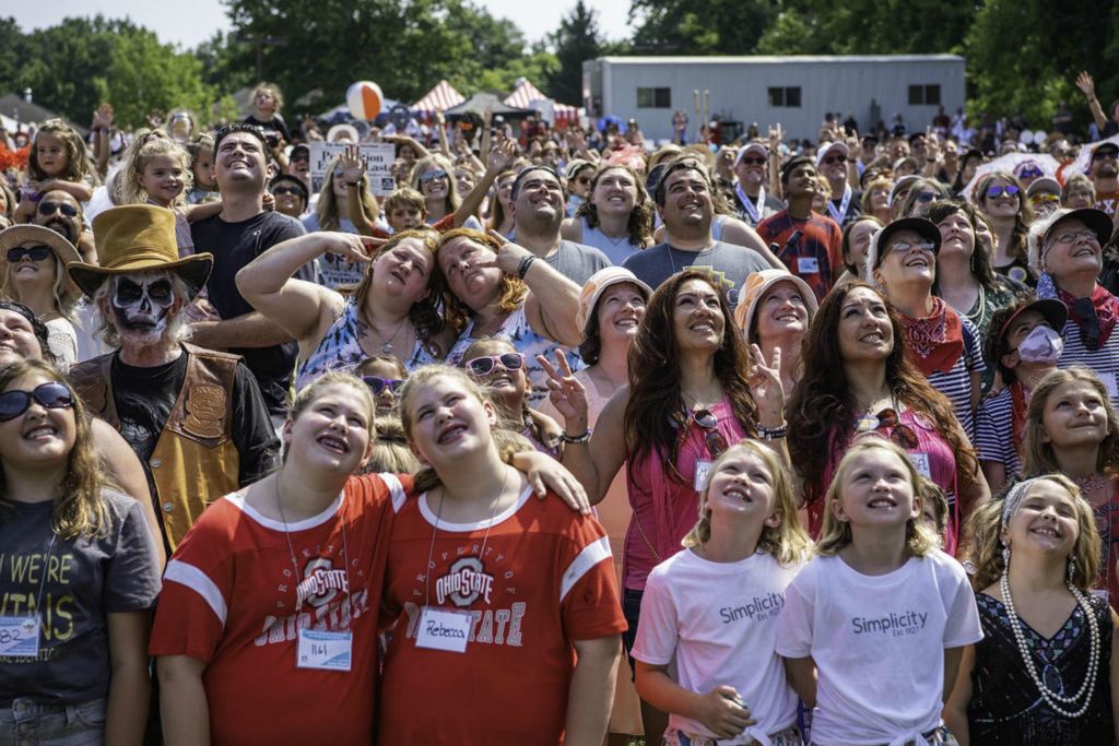 Second Place - Larry Fullerton Photojournalism Scholarship -  A large group of twins take a group photo overhead for the annual Twins Days festival. The annual event had 1,802 sets of twins registered for the 2021 event held in Twinsburg, Ohio on Aug. 7, 2021. (Ryan Grzybowski - Ohio University)  