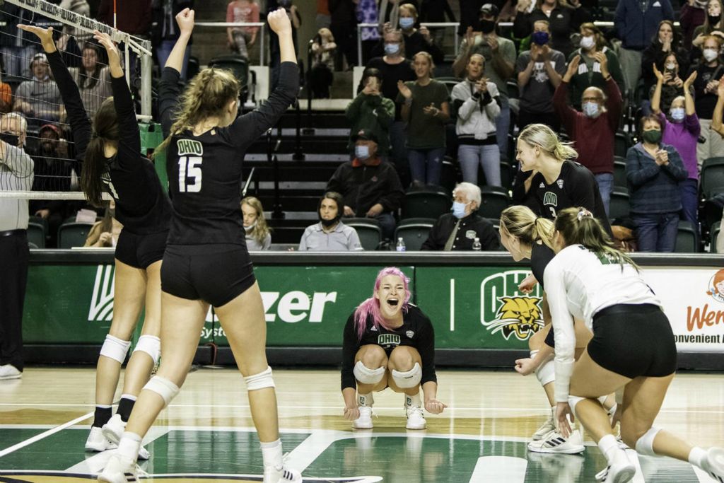 Second Place - Larry Fullerton Photojournalism Scholarship -  Maggie Nedoma cheer along with her teammates after the final score against Bowling Green State University 3-0 on Nov. 13, 2021. (Ryan Grzybowski - Ohio University)  