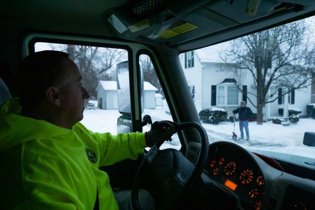 First Place - Larry Fullerton Photojournalism Scholarship -  James Sowders, 49, of Owensville, drives a snow plow for the City of Loveland Public Works in Loveland, Ohio, on Feb. 15, 2021. Sowders has worked for the City of Loveland for 16 years, “I started working at 7:30 this morning, normally I’d be off at 4:00 p.m.,” said Sowders. “Tonight, I’ll be here until midnight before I clock out and another driver takes me place for the rest of the night.” (Joe Timmerman - Ohio University)  