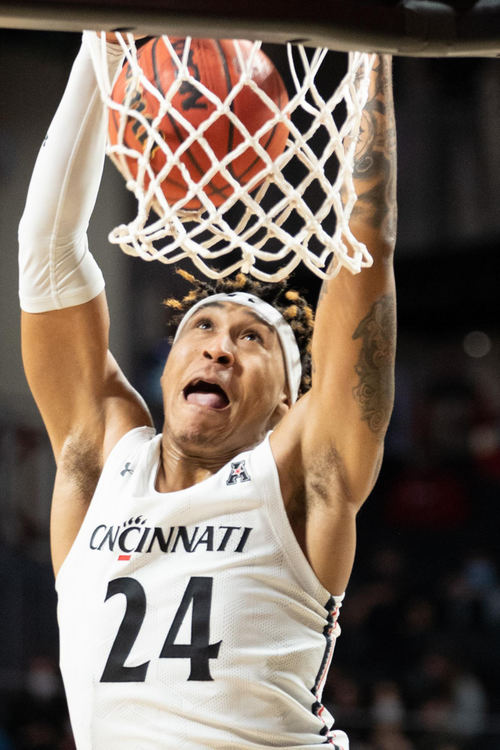 First Place - Larry Fullerton Photojournalism Scholarship -  Cincinnati Bearcats guard Jeremiah Davenport (24) slams in a dunk against the Vanderbilt Commodores in the second half of an NCAA men’s basketball game, March 4, 2021 at Fifth Third Arena in Cincinnati. (Joe Timmerman - Ohio University)  