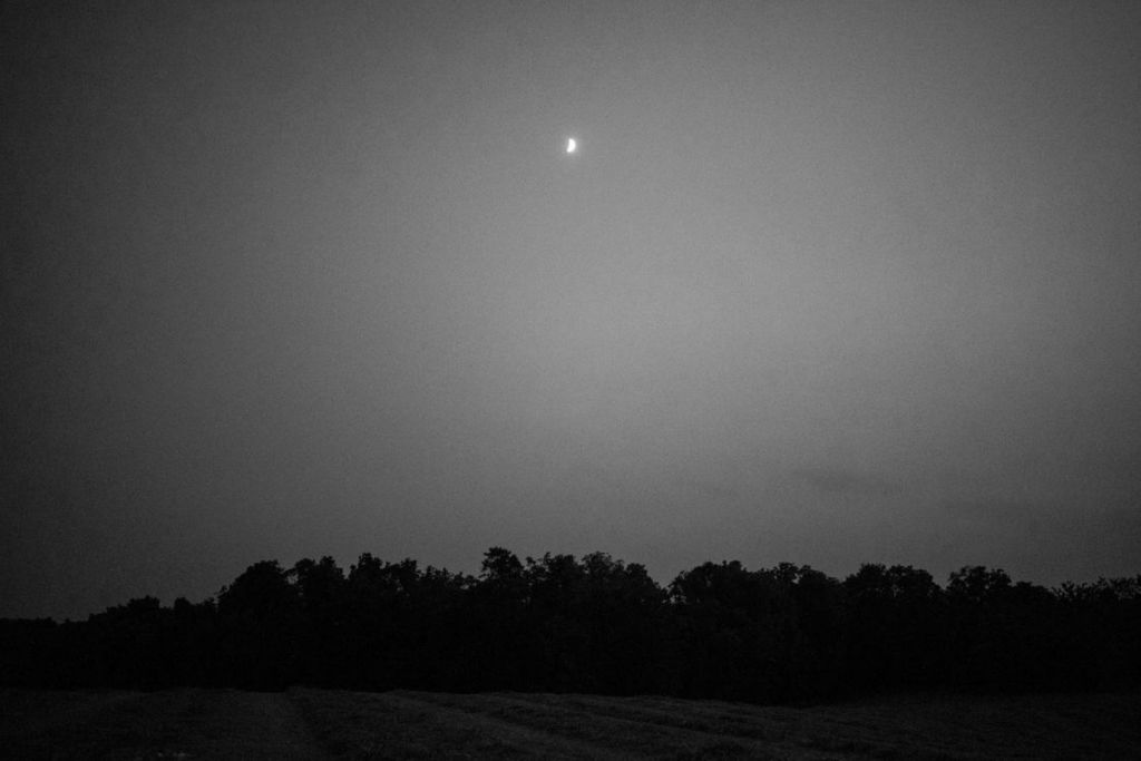 First Place - Larry Fullerton Photojournalism Scholarship -  The waxing crescent moon rises above a peaceful sky in Athens, Ohio, on the evening of Sept. 12, 2021. After a year and a half, I've returned to Athens for in-person school at Ohio University where I'll stay for my remaining two years — still hopeful for the future. (Joe Timmerman - Ohio University)  