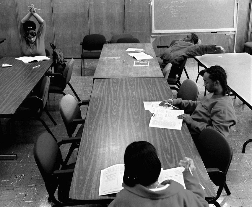 First Place, Feature Picture Story - Steven M. Herppich / Cincinnati EnquirerDanielle Isham, Vivianna Price, Brian Gentry, and Denise Duskin take the common exam to graduate the 9th grade during Ms. Houck's English class. The exam was given to students who either failed or did not take the exam last year. Danielle and Vivianna passed Sandy Houck's English class. Brian and Denise did not.