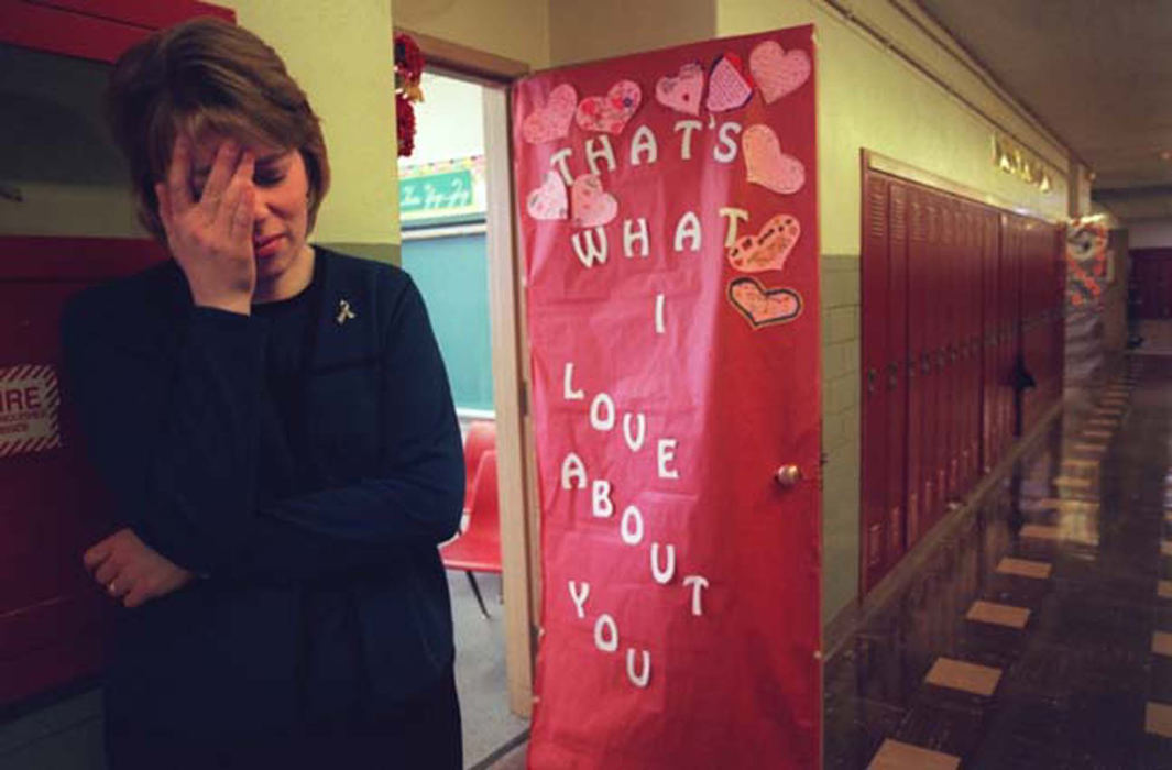 Third Place, Feature Picture Story - Jocelyn Williams / Akron Beacon JournalLakeview Elementary School fifth grade teacher Julie Gulley was a good friend to Dare officer Tobie Cozy Reed.  Gulley made an announcement to her class about Reed losing her bout with cancer.  After sharing the news, Gulley needed a moment outside her classroom.  The sign on the door reflects how the school feels about Tobie Cozy Reed.  