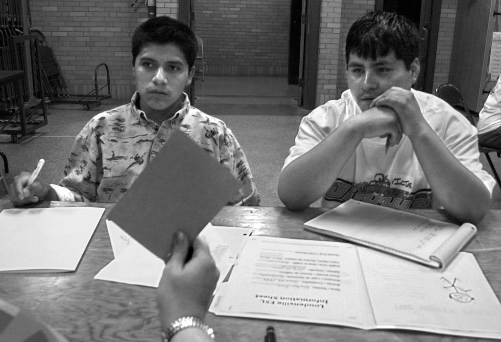 Award of Excellence, Feature Picture Story - Bob DeMay / Akron Beacon JournalMichael and Victor identify color flash cards during English class at a local church. Language is the biggest hurdle facing immigrants as they try to blend into society.