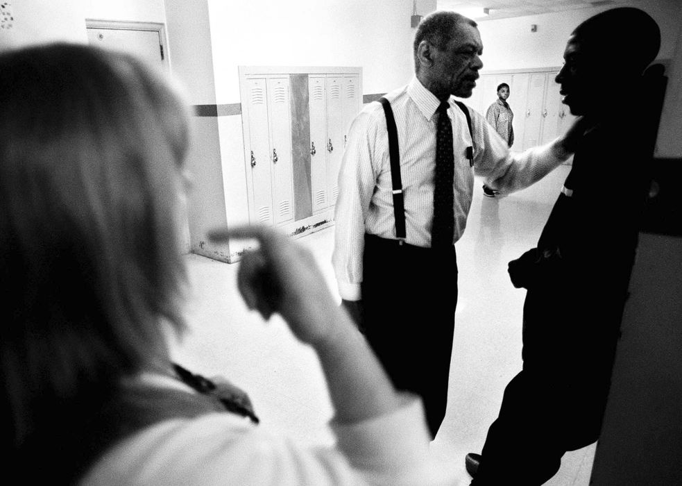 First Place, Feature Picture Story - Steven M. Herppich / Cincinnati EnquirerTeachers Ms. Houck and Mr. Solomon try to get Maurice Brewster into his classroom after a disruption in the hallway at Robert A. Taft High School in the West End. Maurice is in Sandy Houck's 9th/10th grade English class. Students in this class failed 9th grade English and need to pass this class to get credit for both years. 