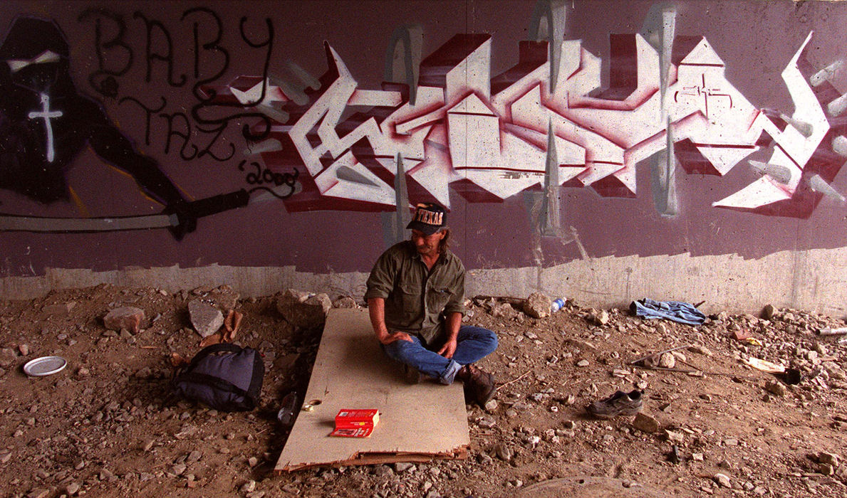 Award of Excellence, Feature Picture Story - Mike Levy / THE PLAIN DEALERPerhaps people can think of graffiti as wallpaper for drifters like John Henry who found a room with a view under a bridge off of W. 25th street. 