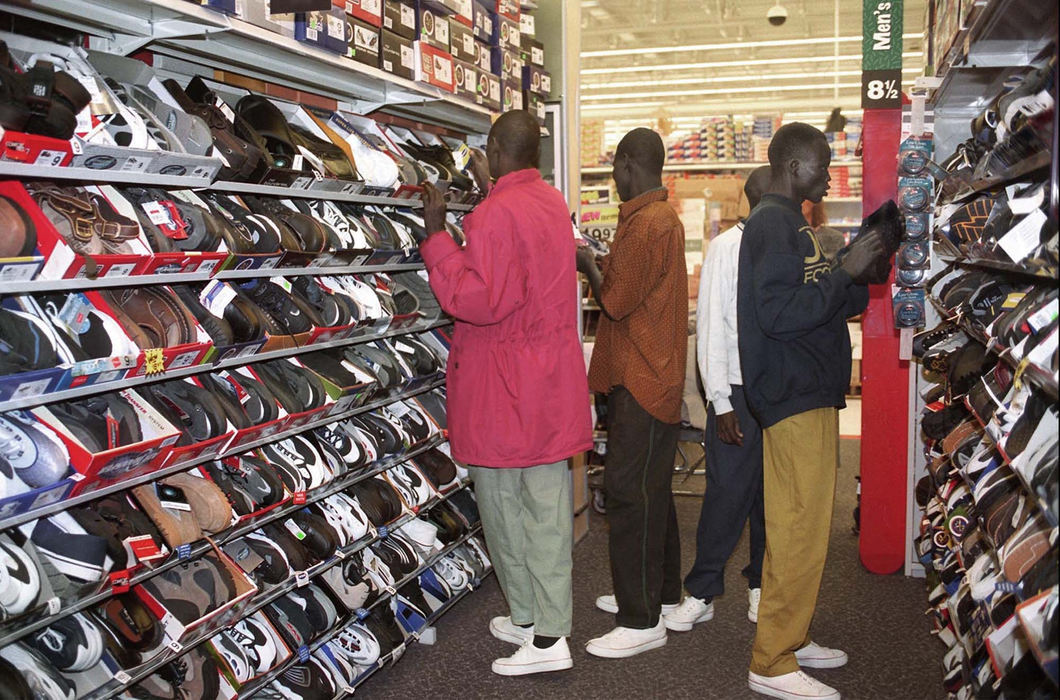 Award of Excellence, Feature Picture Story - Lynn Ischay / The Plain DealerLooking to replace the canvas shoes they were issued in Nairobi before their flight to the US, Peter Kelei, Anthony Akuak Nhial, Peter Awol and Peter Alier Reech are overwhelmed with the many choices at Wal Mart in Cleveland Heights. 