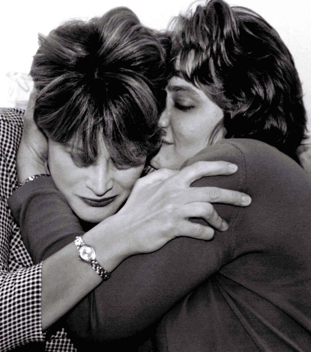 Award of Excellence, Feature Picture Story - Brandi Stafford / The Cincinnati EnquirerAlaina and Gina hug and cry after reading a poem Gina wrote for her sister. 