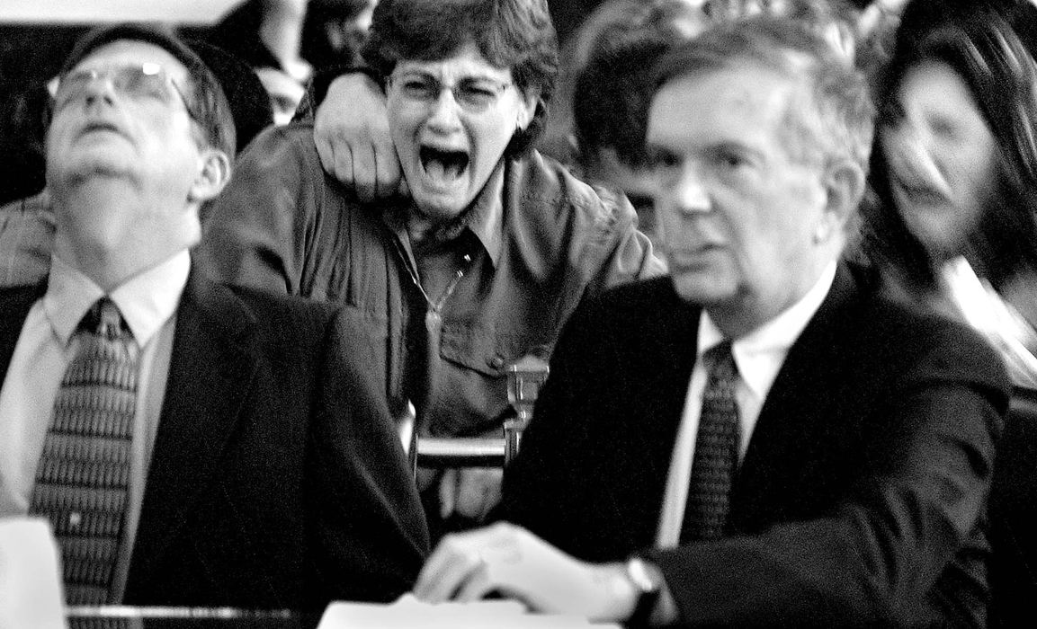 First Place, General News - Michael E. Keating  / Cincinnati EnquirerDebi Wehrung, wife of accused murderer Michael Wehrung (left) screams as a not guilty verdict is read in the 1963 case where Michael Wehrung, then 15, was accused of killing his teen girlfriend.  Charges were brought decades later by county prosecutors. 