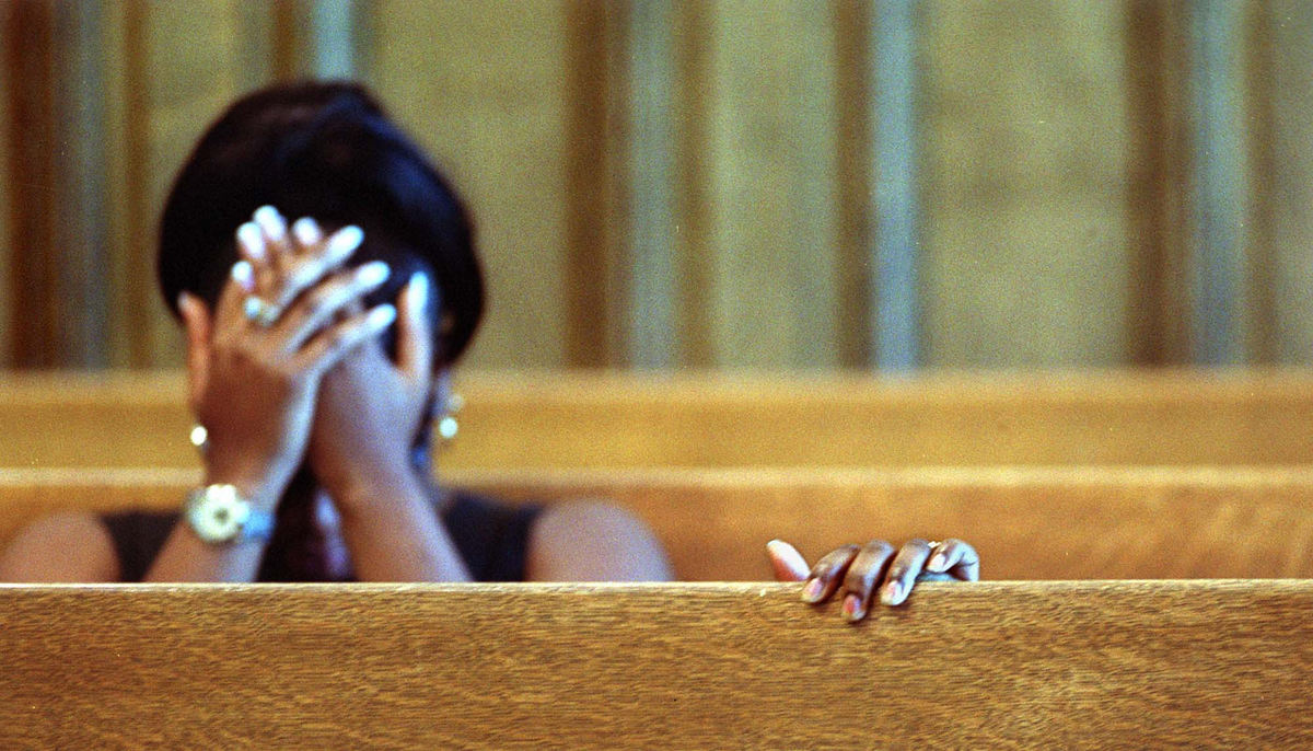 Award of Excellence, General News - Jocelyn Williams / Akron Beacon JournalTysha Williams grips the back of a seat as she collapses in grief in the Summit County Courthouse. Raymond Jackson pleaded guilty in the death of Williams' three-year-old Lamont  Settles. Her sister, La-Angel Williams holds  her face.  