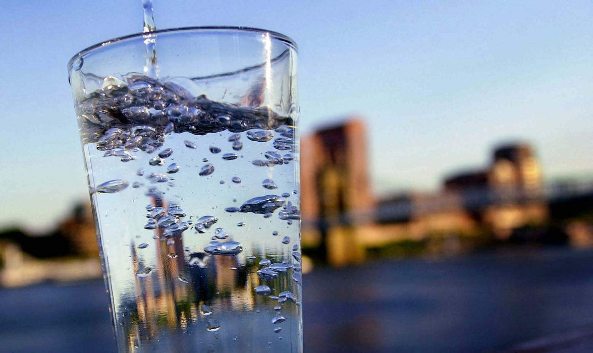 Award of Excellence, Issue illustration - Brandi Stafford / The Cincinnati EnquirerA glass of water photographed with Northern Kentucky and the Ohio River in the background to illustrate Northern Kentucky beating Cincinnati in a water taste test.