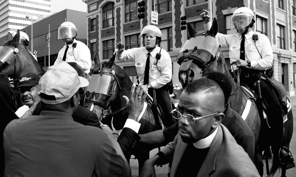 First Place, News Picture Story - Steven M. Herppich / Cincinnati EnquirerMounted Police push protestors back from Central Parkway and Race Street Wednesday afternoon. The group started a march from the sight of the shooting of Timothy Thomas on Republic and 13th Street and was stopped before reaching the downtown area.