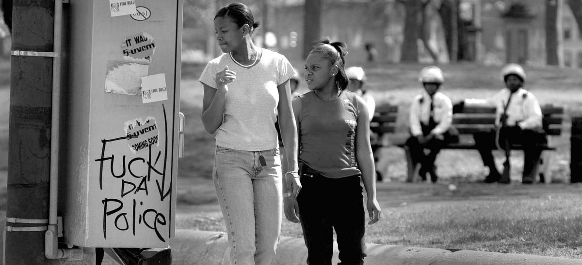 Second Place, News Picture Story - Michael E. Keating / Cincinnati EnquirerIn a moment where the unrest took a breath and emotions settled a bit these teen girls pass by the park as graffiti expresses sentiments of some in the neighborhood. Police maintained a presence as an unsteady calm took hold.