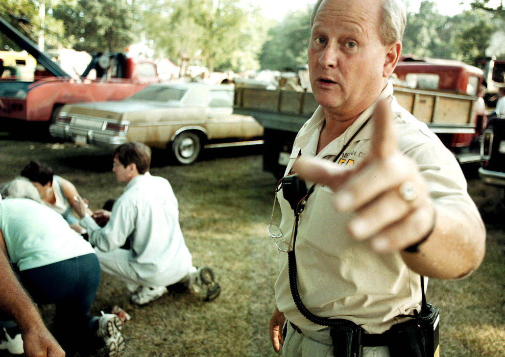 Third Place, News Picture Story - Shirley Ware / The Medina GazetteJim Bigam, a Medina County fair board member and the head of security at Medina County Fair threatens to arrest photographer at scene of steam engine explosion. Bigam was also a detective for the city of Medina's police department.