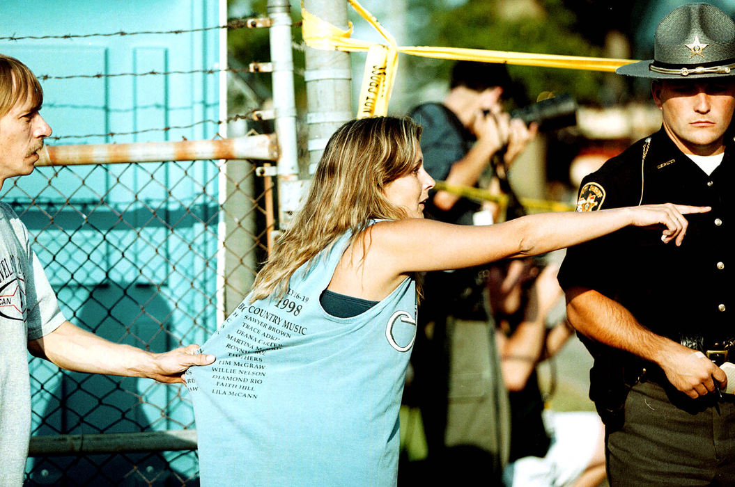 Third Place, News Picture Story - Shirley Ware / The Medina GazetteAs young mothers arrives at Medina County Fairgrounds looking for her young sons, she is held back as she spies paramedics working on the young victims.