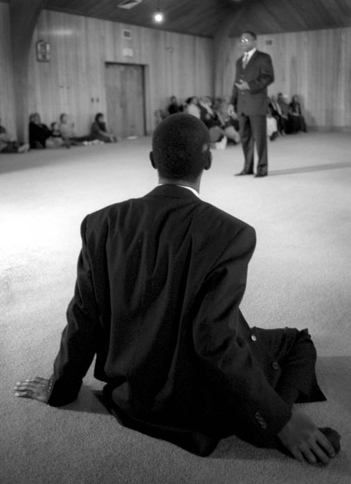 Award of Excellence, News Picture Story - Dale Omori / The Plain DealerA member of the Masjid Bilal mosque sits on the floor after prayer and listens to Cleveland mayoral candidate Raymond Pierce Cleveland, Ohio.  After the service Imam Clyde Rahman announced the mosque's endorsement of Pierce.  The mosque is located on Cleveland's predominately African American East Side where Pierce won 75% of the vote.