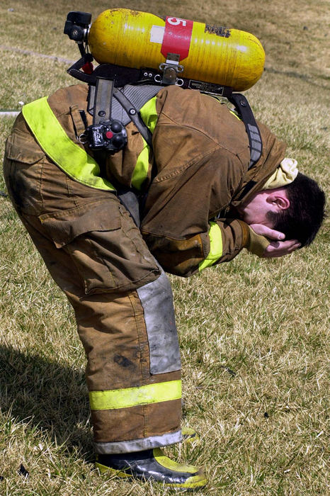 Award of Excellence, News Picture Story - Glenn Hartong / The Cincinnati EnquirerA Miami Township firefighter cries after helping rescue fellow firefighter/paramedic Bill Ellison from a burning home during a three-alarm fire> Firefighter Ellison died several days later from his injuries.