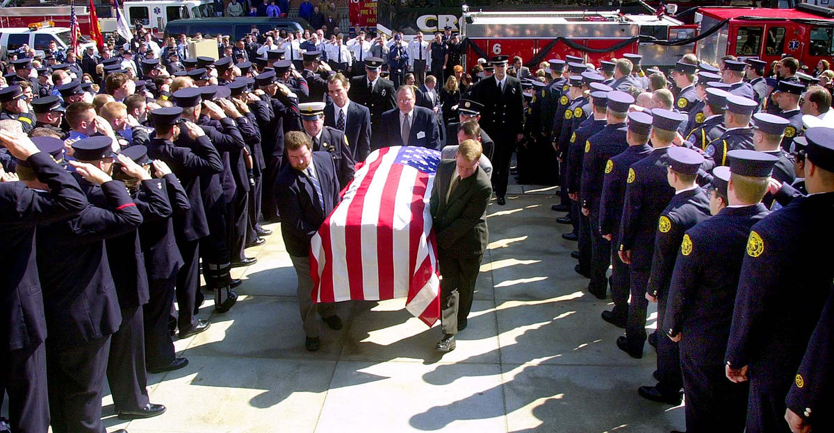 Award of Excellence, News Picture Story - Glenn Hartong / The Cincinnati EnquirerWith thousands in attendance pallbearers, family and brother firefighters,  carry firefighter/paramedic William "Doc" Ellison into Saint Peter in Chains Cathedral in downtown Cincinnati. 