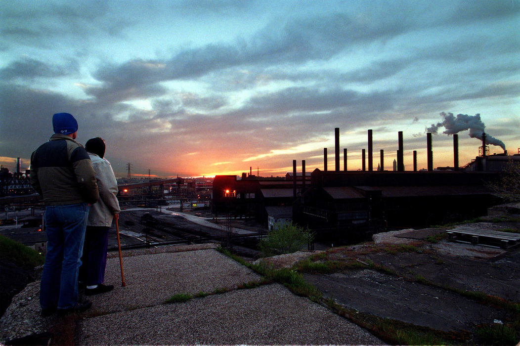 First Place, Ohio Understanding Award - Mike Levy / The Plain Dealer1997 a couple taking their evening stroll walk out to the the end of closed Pershing Rd. and watch the sunset over LYV.   