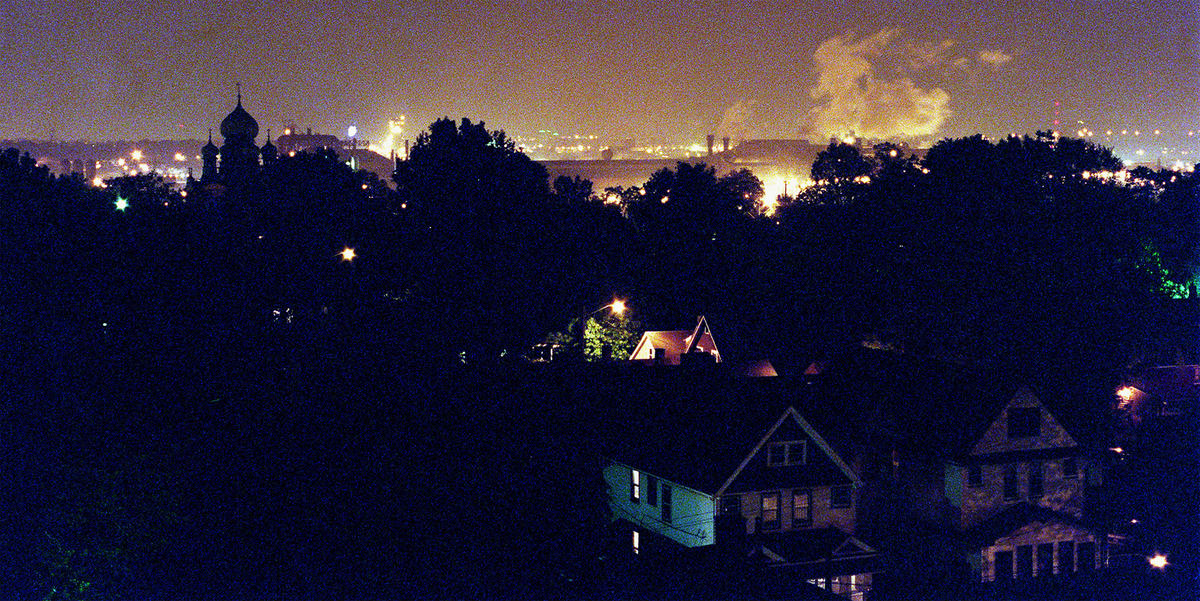 First Place, Ohio Understanding Award - Mike Levy / The Plain DealerThe neighborhood north of LTV shot from a roof top in Tremont shows the domes of St. Theodosius mingling with the smoke of LTV.