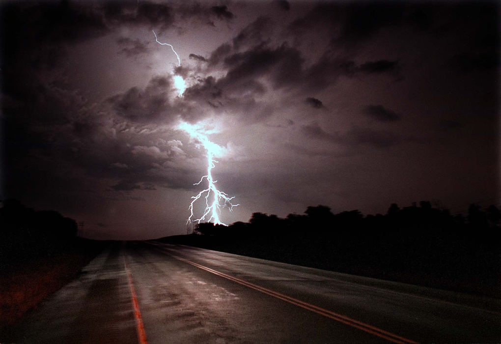 Third Place, Pictorial - Allan Detrich / The BladeA cloud to ground lightning srtike hits in the middle of nowhere along a country road in rural Oklahoma.